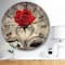 Designart 'Red Rose Inside The Book Modern Wall Clock